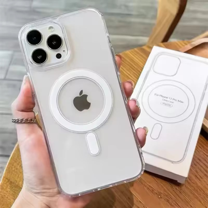 Clear phone case with Apple logo held by a hand, next to its packaging on a wooden surface.